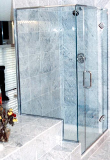 FRAMELESS  CORNER SHOWERS WITH HEADER RAILS