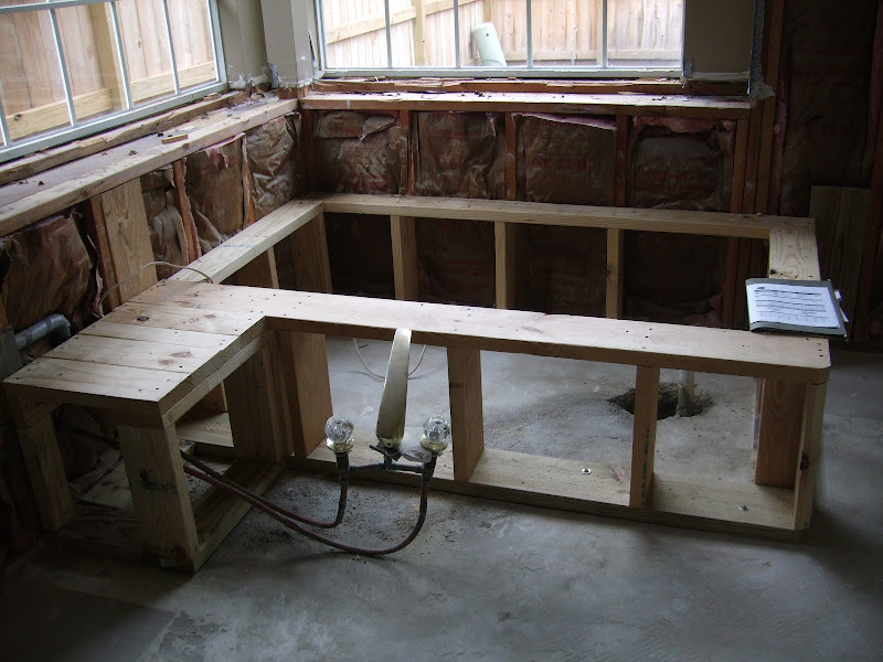 New tub deck for our rectangular tub in this modern bathroom redo. title=