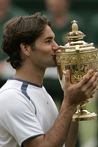 Roger Kisses His Trophy