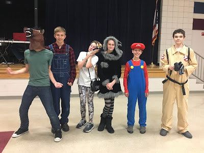 Boy dressed as a horse man, a farmer, Mario, and Ghostbuster