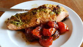 Pan-seared wild salmon with pesto and blistered cherry tomatoes