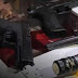 Velan restos de joven en Santiago Oeste exhibiendo armas de fuego en ataúd