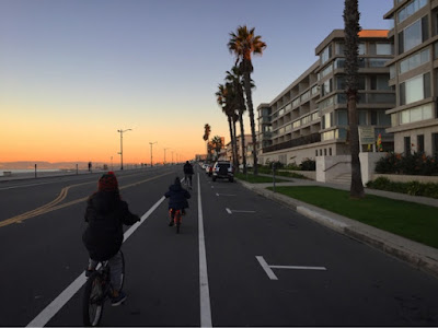 Sunrise family bike rides along the beach