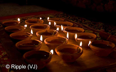 Posted by Ripple (VJ) : Diwali Celebrations 2008 (Indian Festivals of Lights): Clay Diyas during Laxmi Pooja from different angle