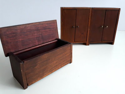 One-twelfth scale vintage dark-wood cupboards and blanket chest.