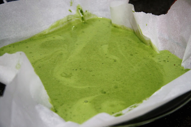 light green mochi cake batter in a pan