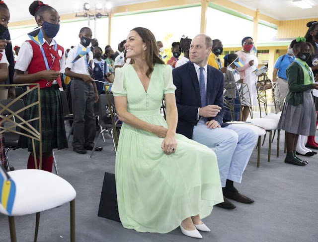 Kate Middleton wore a pleated chiffon midi dress by Self-Portrait, and gold maya earrings by Nadia Irena