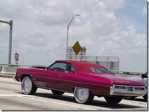 .... we see this pimped out ride, spinners and bling and all. Yes it is an "eish" behind the wheel.