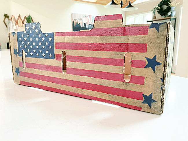 stained red white and blue crate