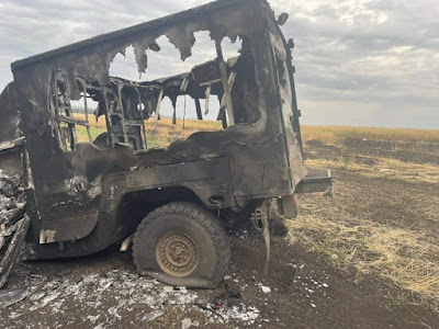 remains of another US (made if not operated) Humvee truck destroyed somewhere in summertime in Ukraine