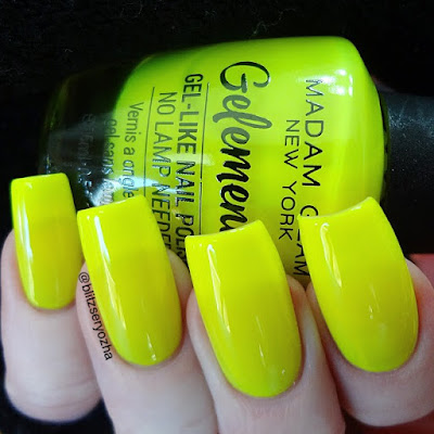 A swatch photo showing three coats of Madam Glam "Cheerleading Squad," a neon yellow creme polish