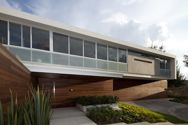 Wood and concrete facade of the FF House in Mexico