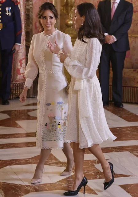 Queen Letizia wore a dots-style chiffon silk midi dress by Carolina Herrera. Infanta Sofia. First Lady Silvana Lopez Moreira