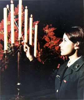 Villazana lights Christmas candles at the WAC Chapel