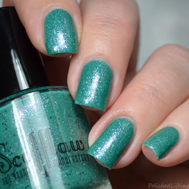 teal crelly nail polish with shimmer