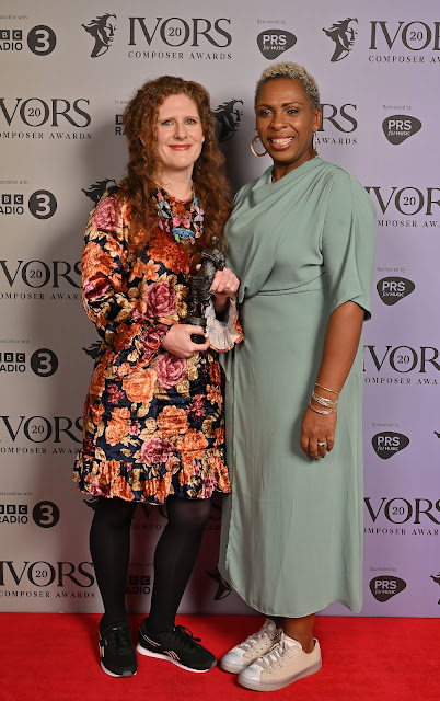 Cheryl Frances-Hoad accepts the Ivor Novello Award for Large Ensemble from Michelle Escoffery (Photo: Mark Allan Photography)