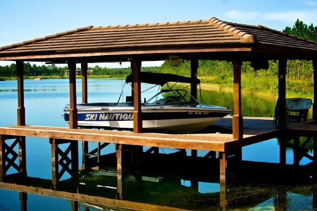 Picture of the boat parked in garage on the lake