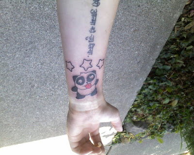 lettering tattoo with panda tattoo on forehand tattoos