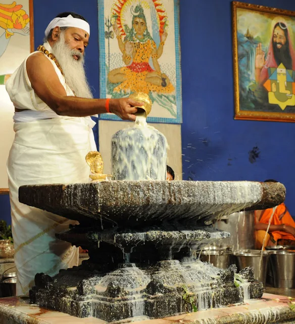 Shivalingam is given a special bath with milk