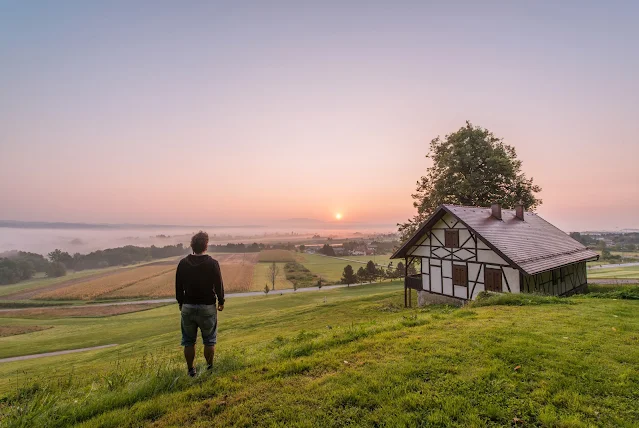 Traveler walking through an empty medieval village, soaking in the atmosphere