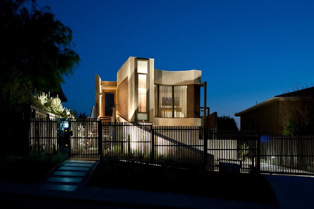 Modern home and fence from the street 