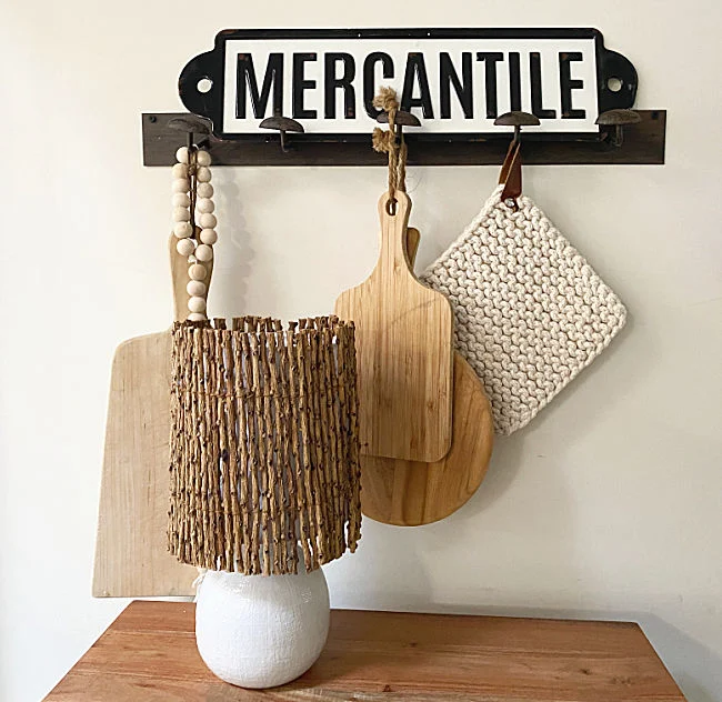 cutting boards, lamp and mercantile sign