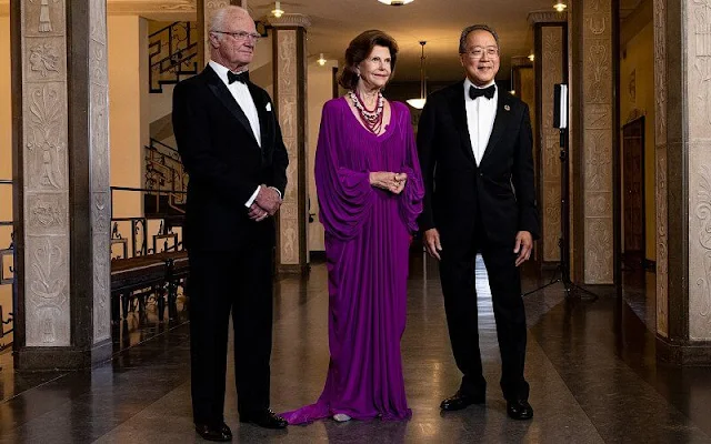 Queen Silvia attended the award ceremony of The Birgit Nilsson Prize. Cellist Yo-Yo Ma. Queen Silvia wore a purple gown