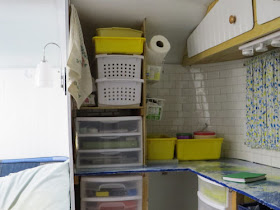 interior of a fiberglass trailer decorated in blue and yellow