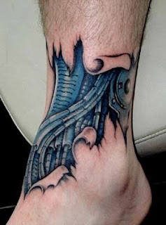 biomechanical tattoo on the ankle
