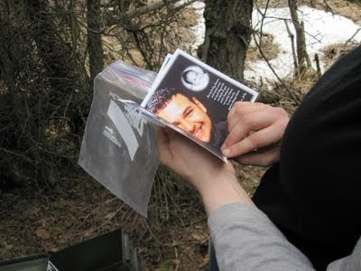 A picture of Jennifer Wirawan reading Jody Wirawan birthday memorial card.