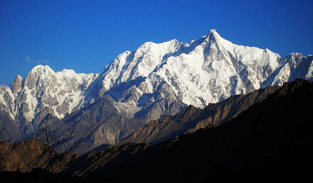 Mountain view from Hunza valley. Peak in Hunza valley Saruchit Sar 6576 m, Ultar Sar right 7388 m, left Bojohagur Duanasir I 7329 m, Bojohagur Duanasir II (Bajo Bula) 7200 m, Bojoshabram 6150 m, London peak 6930 m, Hunza Peak (6270 m) and Bublimotin lady finger far left 5990 m Hunza, Gilgit Baltistan Pakistan