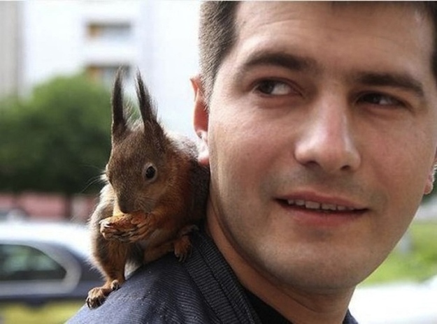 Belarusian soldier rescued baby squirrel and now they're best friends, a soldier and squirrel, baby squirrel