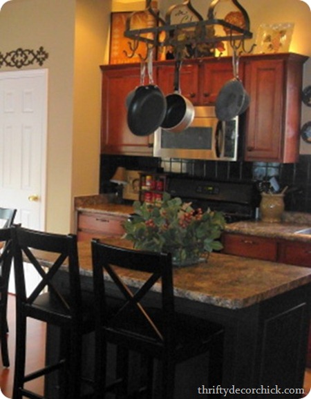 black backsplash, wood cabinets