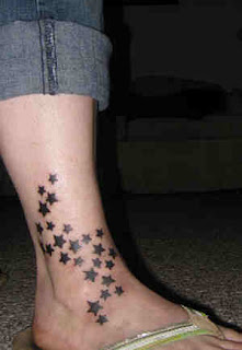 smal tattoo star on foot for girls