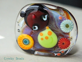 https://www.etsy.com/listing/178457168/handmade-lampwork-beads-creeky-me-creeky?ref=favs_view_1