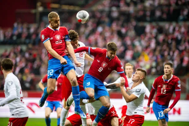 Tomas Soucek of Czechia and Adam Hlozek of Czechia battle