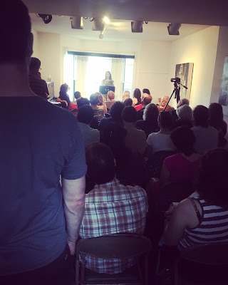 crowd of people at the boston poetry marathon in inman square 2018