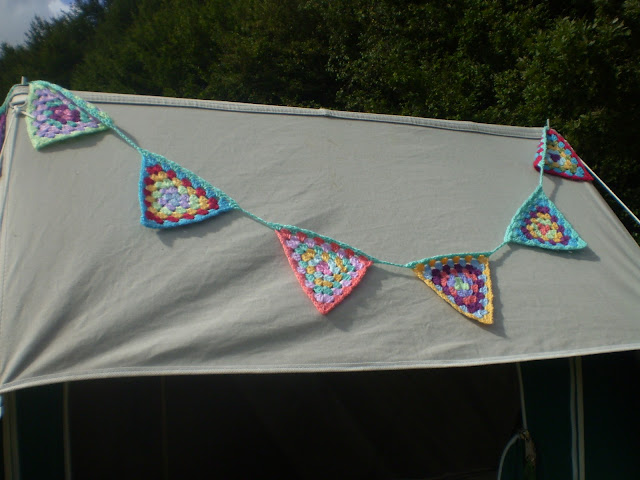 crochet bunting decorating a canvas tent