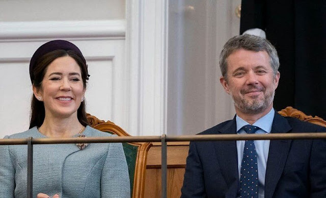 Crown Princess Mary wore a pale blue coat by Claes Iversen. Gianvito Rossi pumps. Jane Taylor purple hat