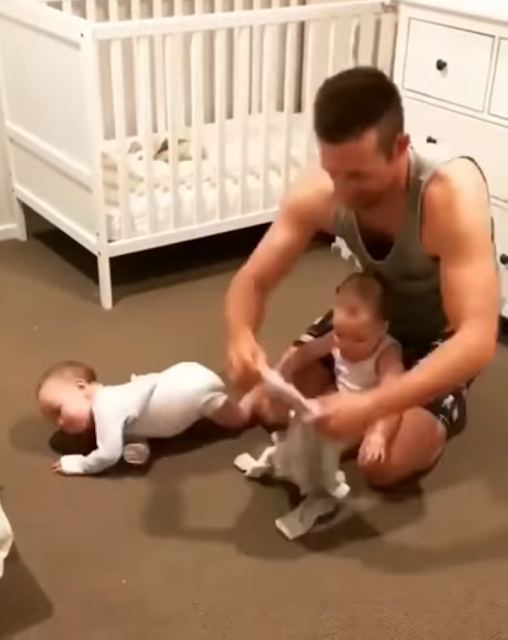 A dad tries to put his twins to sleep but it's not easy enough as we thought