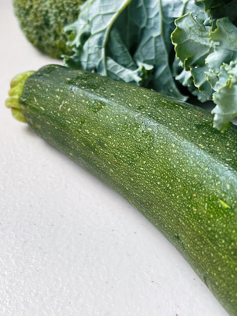 a close up photo of a green zucchini