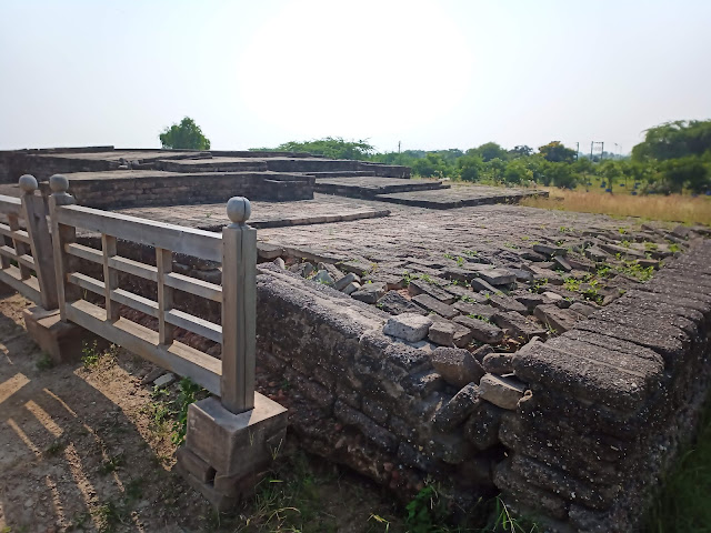 Raised brick structure of upper city of Lothal with a wooden fence next to it