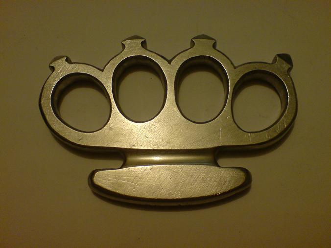 brass knuckles tattoos. rass knuckle tattoo. meaning