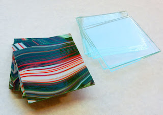 4" squares of Fusers Reserve green/red/white and clear