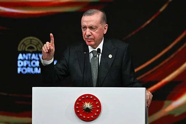 Turkish President Recep Tayyip Erdogan gestures while delivering a speech at the opening ceremony of the fourth edition of the Antalya Diplomacy Forum (ADF2025) in Antalya on April 11, 2025. Photo by Ozan Kose/AFP