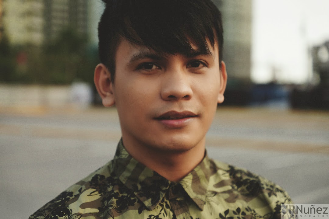 Bibo Bayona wearing camouflage shirt