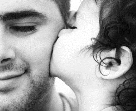 little girl kissing daddy