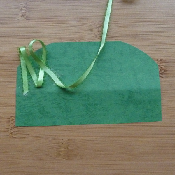 Green colored card and ribbon