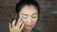 Sparkling Green New Year's Eve make up -Next, to the eyes area. Apply this shimmery color to the entire eyelid and then blend it towards the brow bone. 