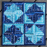 Miniature log cabin quilt for the teal mini quilt swap